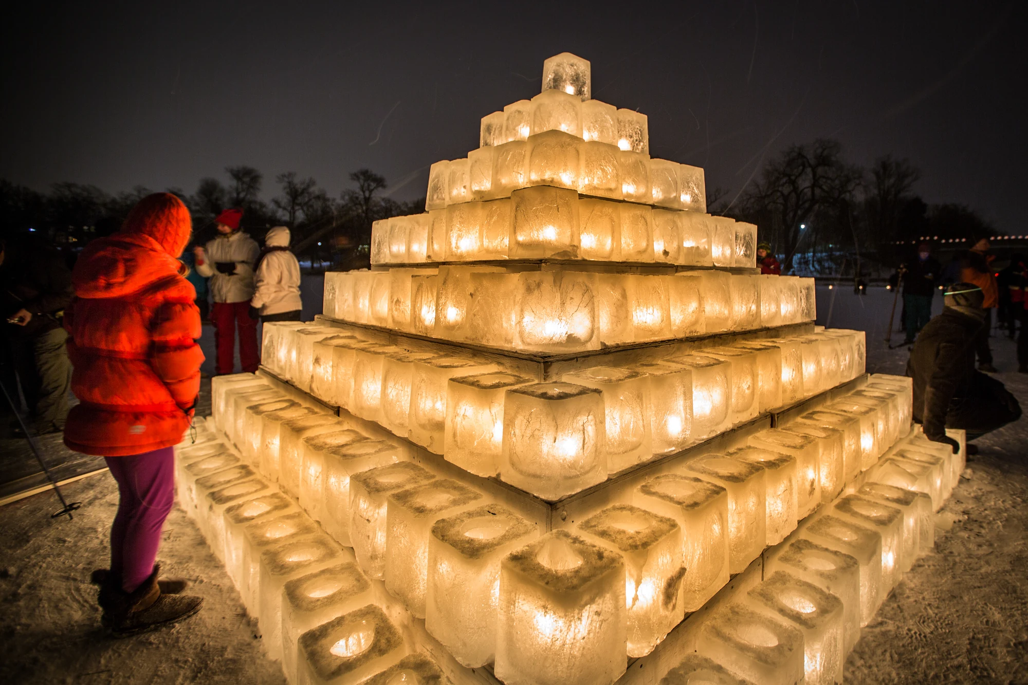 People gather around illuminated ice blocks at the 2013 City of Lakes Loppet in Minneapolis.