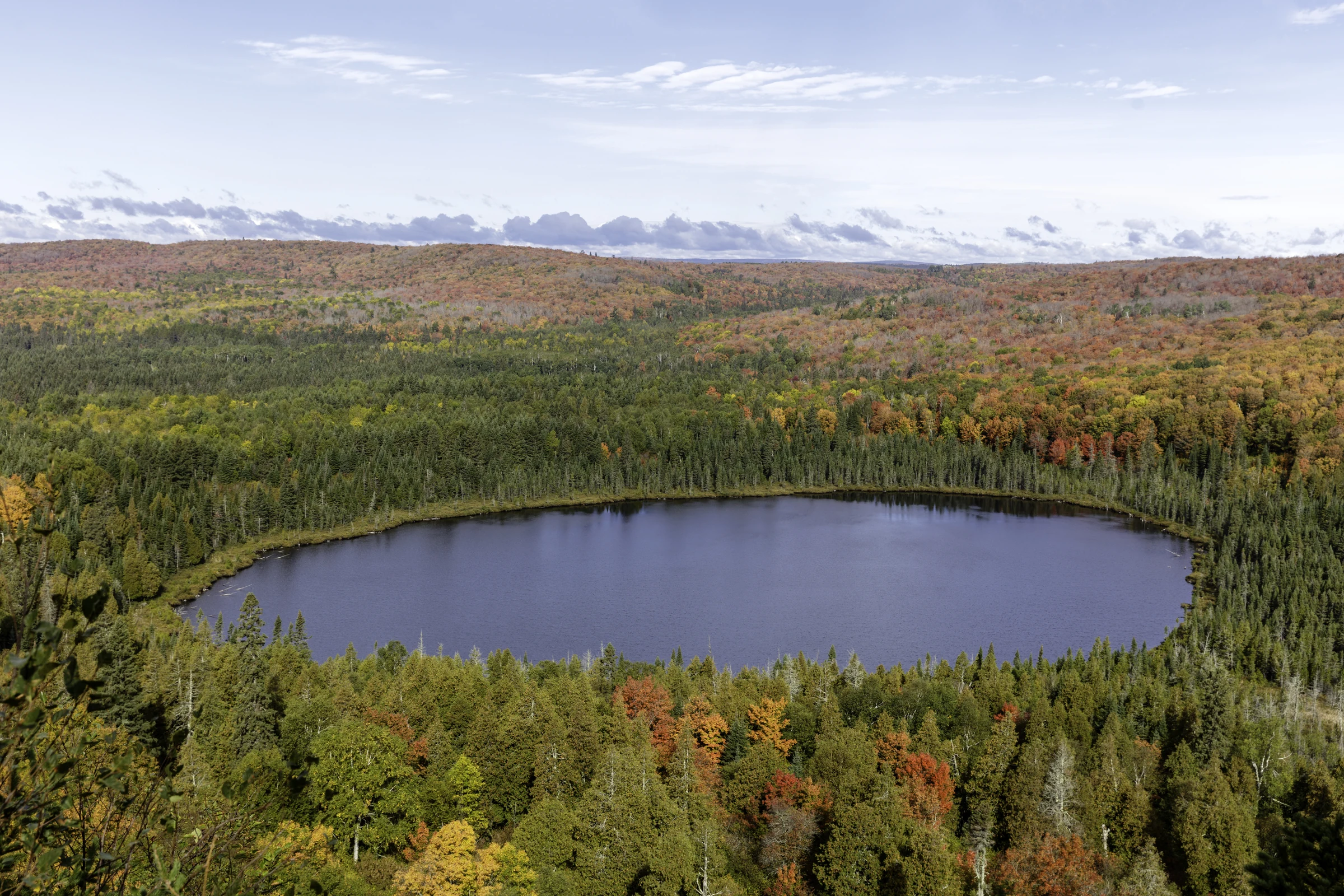 Autumn forest surrounds Oberg Lake near Tofte, Minnesota.